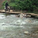 Riding over a bamboo bridge set up when the water is low