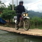 Cool riding style over a bamboo bridge set up when the water is low